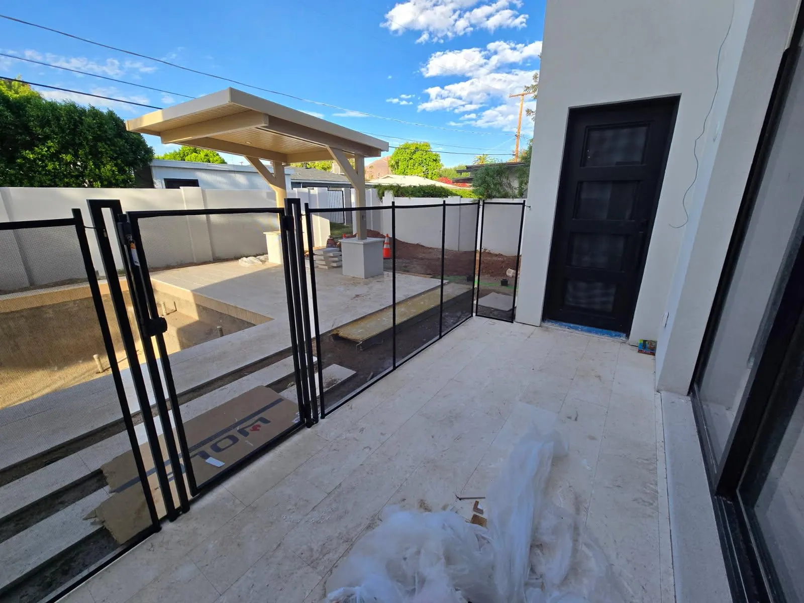 Installed pool gate example showing access between patio and swimming pool