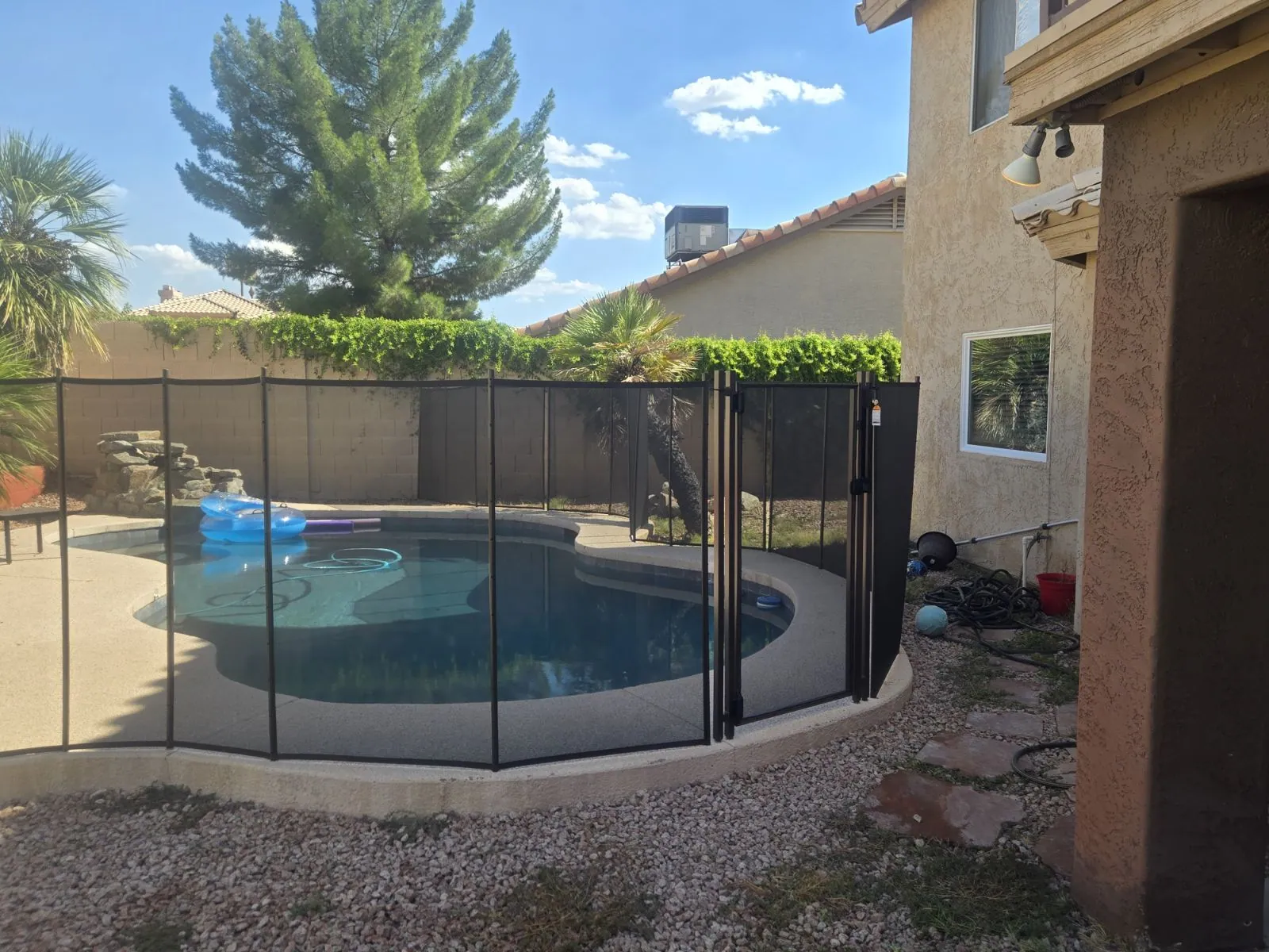 Pool fencing example around a residential swimming pool