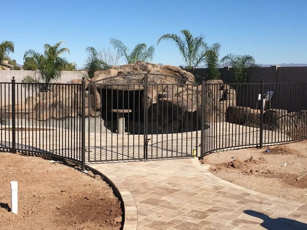 Iron pool fencing around a residential swimming pool