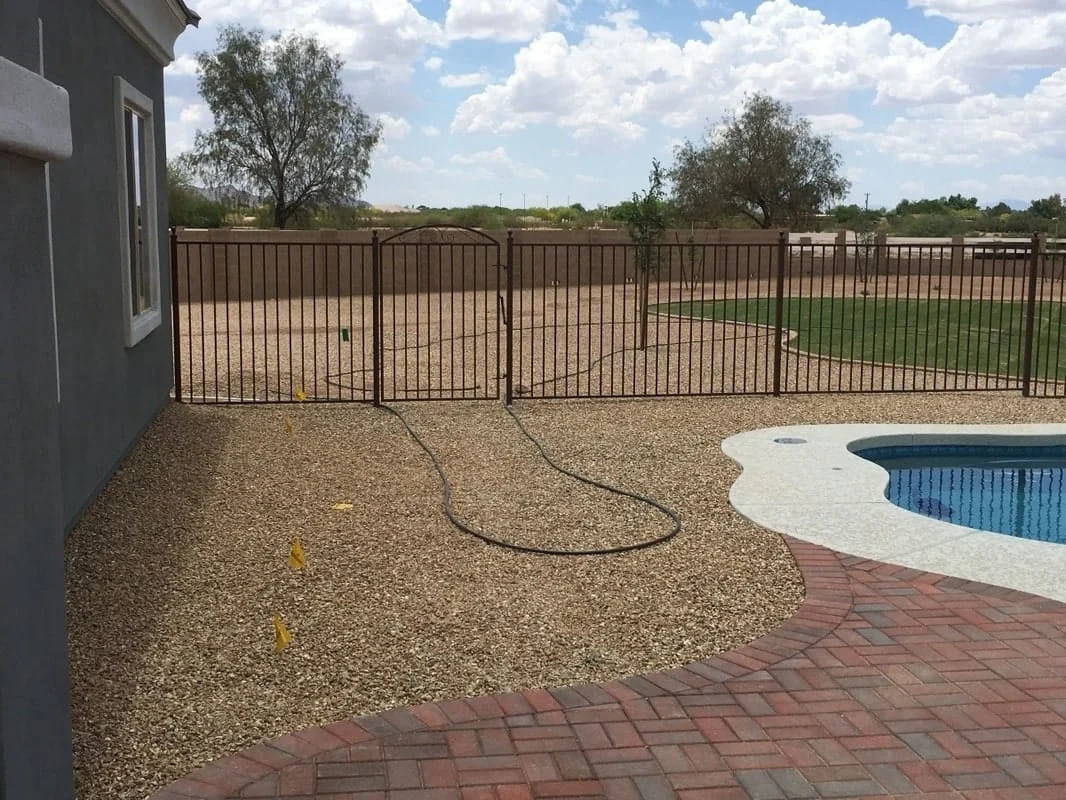 Pool fence and gate example around a residential swimming pool